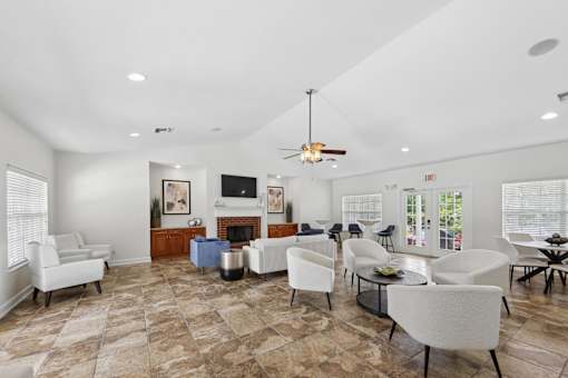 Resident clubhouse lounge at Lancaster Place Apartments in Calera, Alabama with inviting seating and gathering areas for community events.