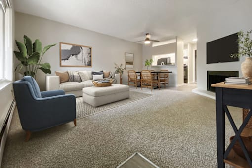 A living room with a blue chair and a grey carpet.