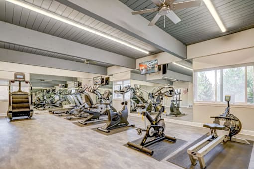 A spacious gym with a variety of exercise equipment.