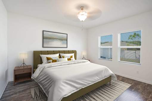 A bedroom with a large bed and a painting on the wall.