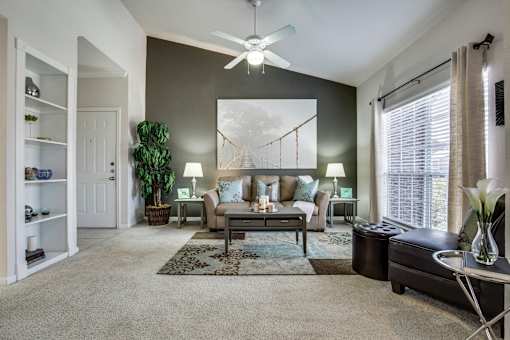 an open living room with a couch and a coffee table