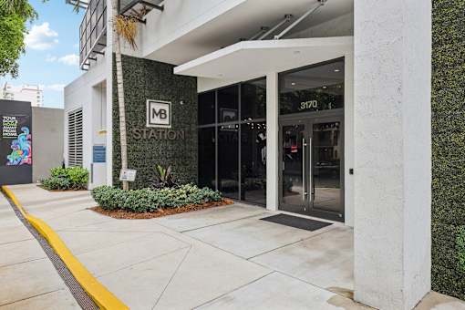 Welcoming entrance to MB Station apartments in Miami's Coral Way neighborhood with professional management and convenient access to nearby shopping, dining, and major employers.