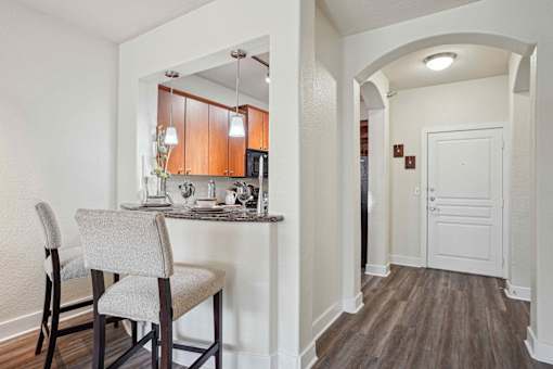 Pet-Friendly Rentals in North Little Rock, AR – Metropolitan – A kitchen with a table and chairs.