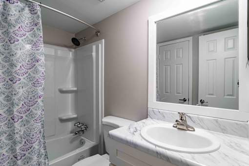 Modern bathroom vanity and mirror lighting in apartments near Briarcliff, Atlanta.