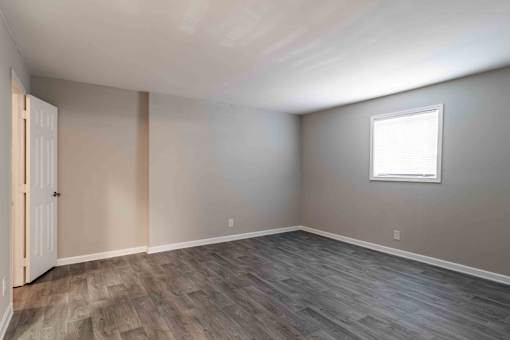 Living area with natural light and neutral flooring at Mirador at Peachtree Apartments.