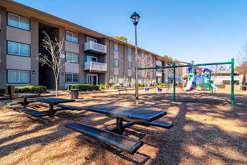 Mirador at Peachtree Apartments photo of picnice tables in front of playground