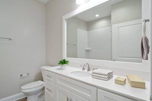 Bathroom with double vanity and modern lighting in Atlanta apartments for rent.