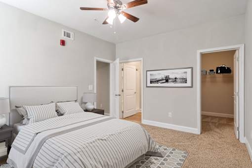 Carpeted bedroom with large closet in pet-friendly apartments near Briarcliff, Atlanta.
