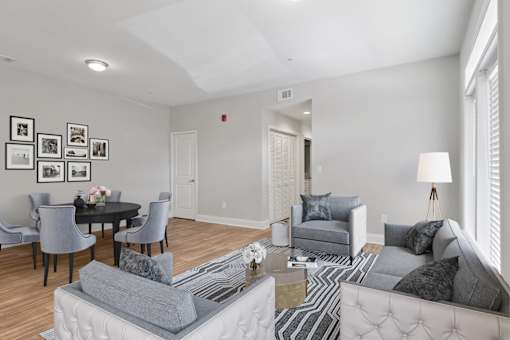 Living room with neutral finishes and updated flooring at Mirador at Peachtree Apartments.