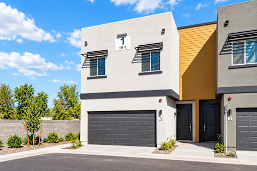 Exterior of a new two-story 3-bedroom townhome with private two-car garage at Villas at 91st in Tolleson, AZ