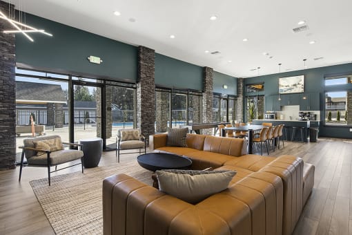 clubhouse with leather couches and chairs,