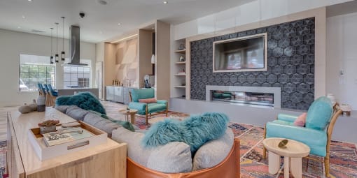 Apartments for Rent in Tigard-Sygnii- Clubhouse with Lounge Seating, Fireplace, TV, and Kitchen