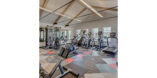 Tigard Apartments-Sygnii-Fitness Center with Equipment, Overhead Lighting, Mirrors, and Windows