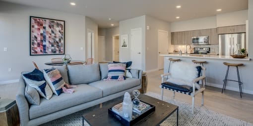 Tigard, OR Apartments-Sygnii- Living Room with an Open Layout, Recessed Lighting, and Hardwood Style Flooring