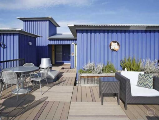 Apartments in Fremont, WA - Epicenter - Rooftop Deck with Outdoor Furniture and Potted Plants