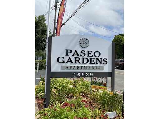 a sign for pasco gardens apartments