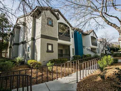 A modern house with a white and blue exterior.