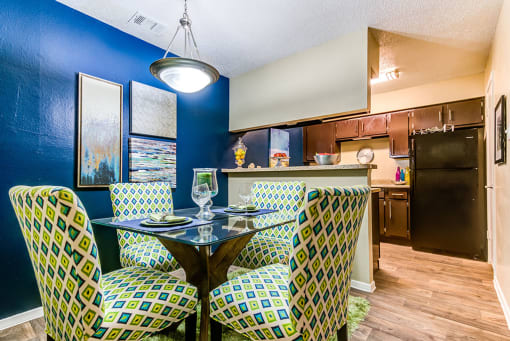 a table for four at the enclave at woodbridge apartments in sugar land, tx