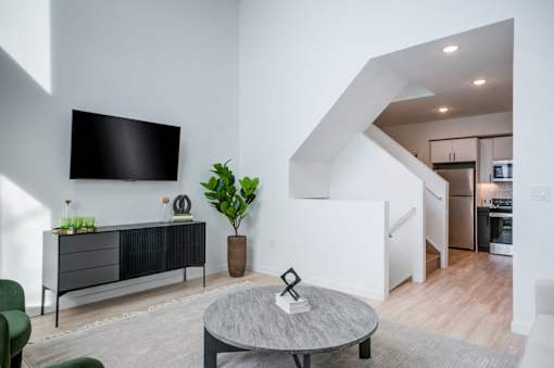 a living room with a tv and a table