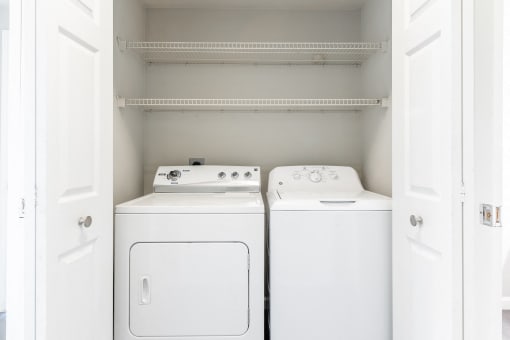Pet-Friendly Apartments in Houston, TX – Westchase Forest – Photo of a small laundry room with a washer and dryer