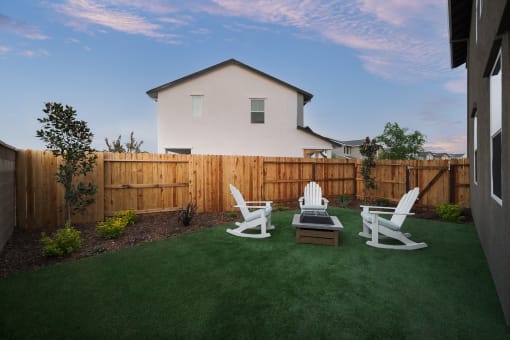 Roseville, CA, Fully Furnished Single Family Homes For Rent - Cyrene At Fiddyment - Fenced-In Backyard With A Firepit, Chars, And Nice Landscaping