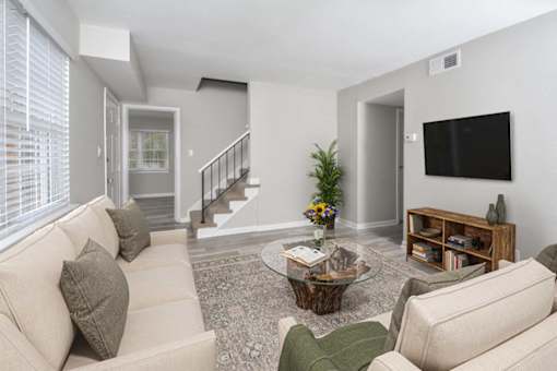 a living room with a couch and a television