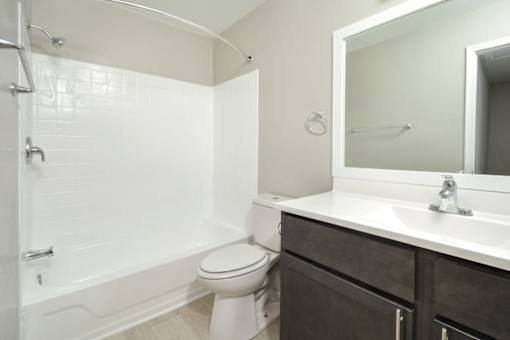 an empty bathroom with a toilet and a sink
