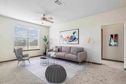 Apartments for Rent in Bentonville, AR 72713– Parc at Bentonville -   Living Room with ceiling fan and large windows