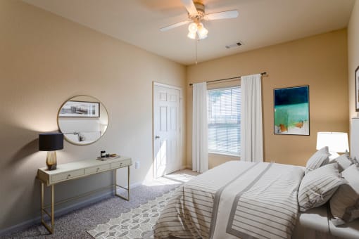 Apartments in Clarksville, TN for Rent - Parc at Clarksville - bedroom with ceiling fan and large window with curtains