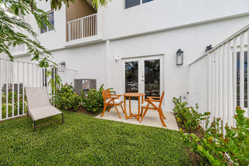 private fenced backyard with patio at Pearl at Pompano Beach pet friendly homes for rent in Pompano Beach FL