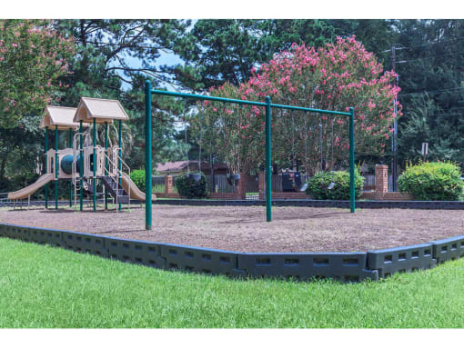 The Jaunt Apartments in Charleston South Carolina photo of a playground with a slide and monkey bars