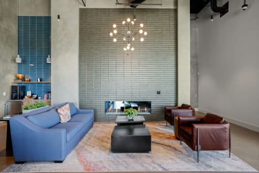 a living room with a blue couch and a coffee table