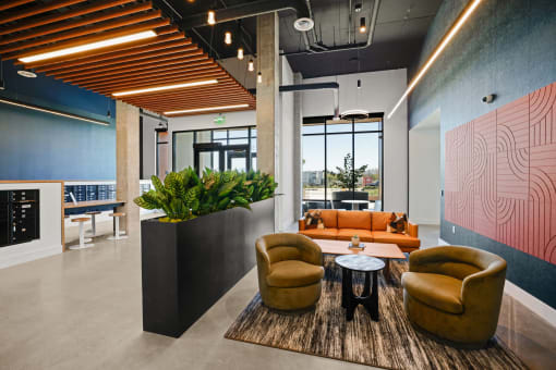 a lobby with couches and chairs and a table