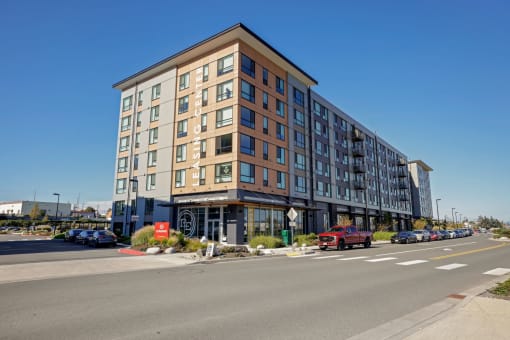 a new apartment building on the corner of a city street