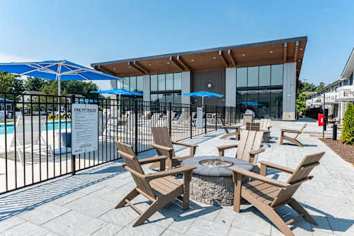 A pool area with chairs and a sign that says "FREE PARKING".