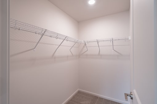 a walk in closet in a 555 waverly unit