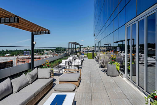3thirty3 new rochelle ny apartment high rise photo of outdoor terrace with multiple seating areas