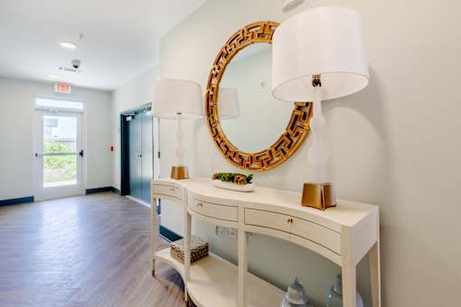 Welcoming resident lobby with decorative furnishings and modern design at Sage 5430 apartments.
