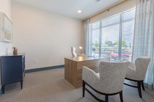 Leasing office with welcoming seating area at Sage 5430 apartment community in Norcross, Georgia.