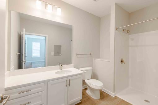 Bathroom in a senior living property in Norcross with modern fixtures and accessible design.