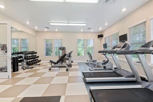 Interior view of the 24-hour fitness center with modern equipment at The Sanctuary at 331