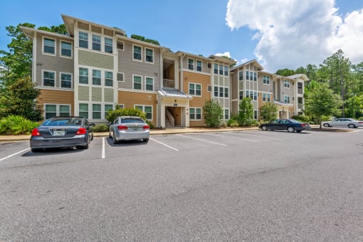Community building exterior highlighting the luxury apartment complex in Santa Rosa Beach