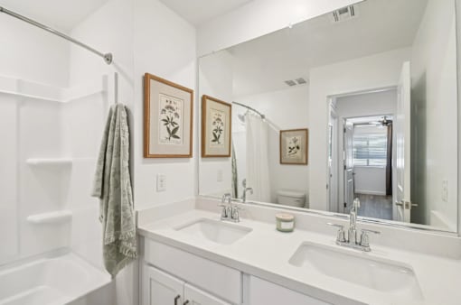 Modern bathroom with double-sink vanity in a new 3-bedroom, 2.5-bath townhome at Villas at 91st in Tolleson