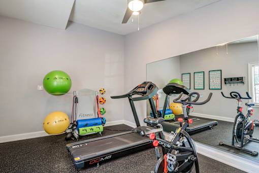plenty of exercise equipment at the whispering winds apartments in pearland, tx
