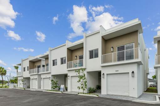 exterior of luxury two story townhomes with attached garages in Pompano Beach Florida homes for rent
