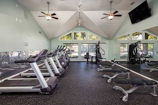 Fitness center with cardio equipment in Stockbridge GA apartment community at Southwinds Point