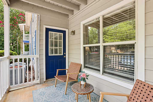 Private patio at Southwinds Point Apartments in Stockbridge, GA featuring outdoor living space for pet-friendly 1, 2 and 3 bedroom apartments.