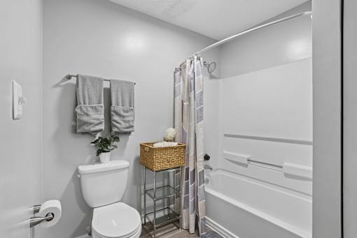 Modern apartment bathroom with updated cabinetry at Southwinds Point Apartments near Atlanta, Georgia.