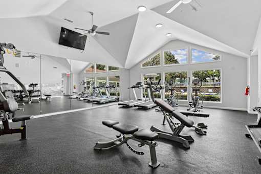 Resident fitness center with vaulted ceilings at Southwinds Point Apartments in Stockbridge, Georgia.