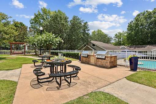 Outdoor grilling station and picnic area at Southwinds Point Apartments in Henry County, Georgia.